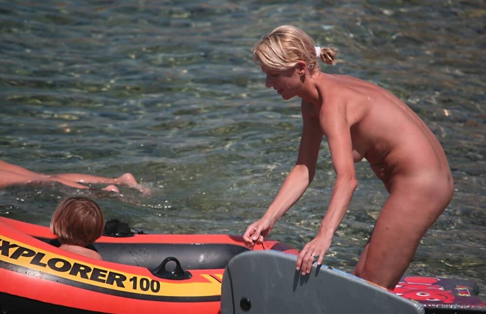 Red Boating for Two Nudists pics - Joy and pleasure are part of the nudist experience