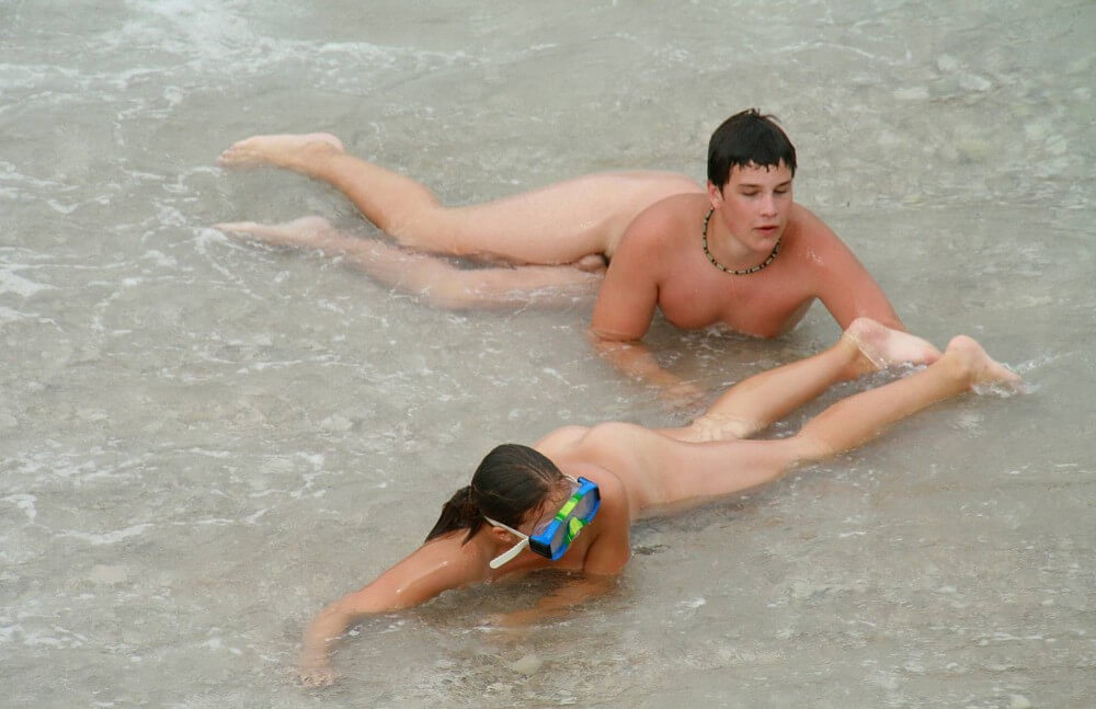 Wading In The Shallows pics - Naturists love movement and activity