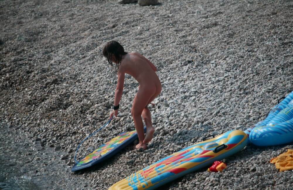 Naturist Surf Board Glides pics - The practice of naturism helps build trust and honesty among people