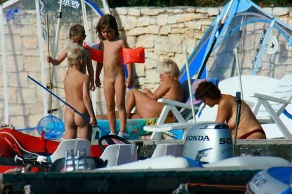 By the boat photos - A nudist values simplicity in life and naturalness in expression