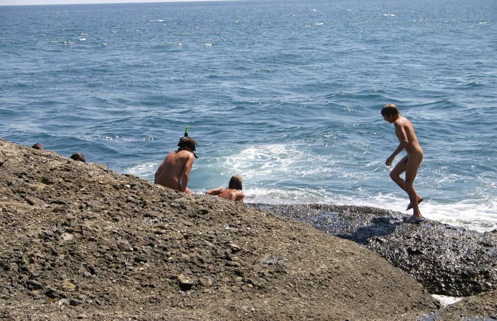 Leaning Against Hit Rocks pics - Naturism teaches respect and love for the natural world